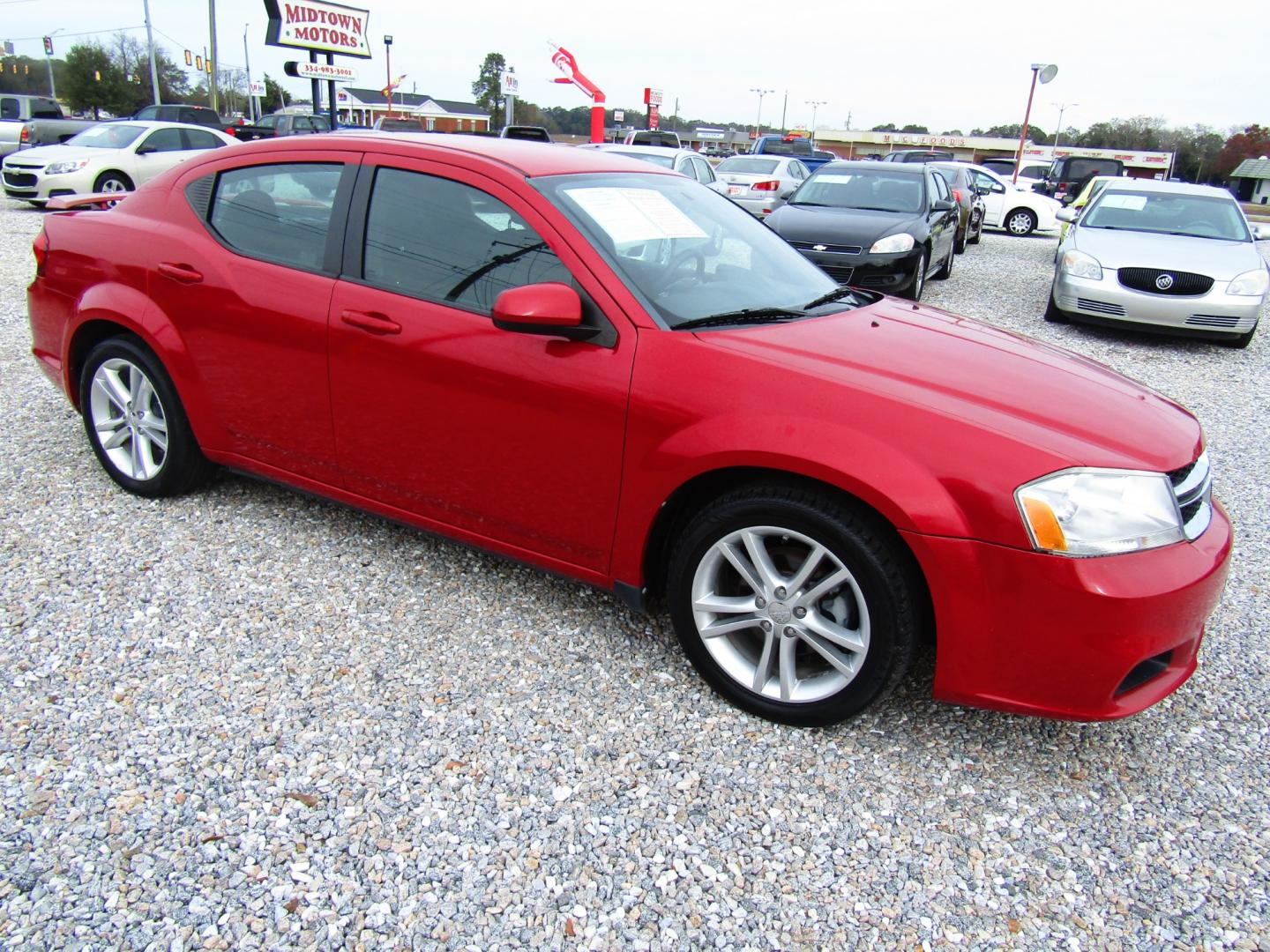 2012 Red Dodge Avenger SXT (1C3CDZEG1CN) with an 3.6L V6 DOHC 24V engine, Automatic transmission, located at 15016 S Hwy 231, Midland City, AL, 36350, (334) 983-3001, 31.306210, -85.495277 - Photo#0